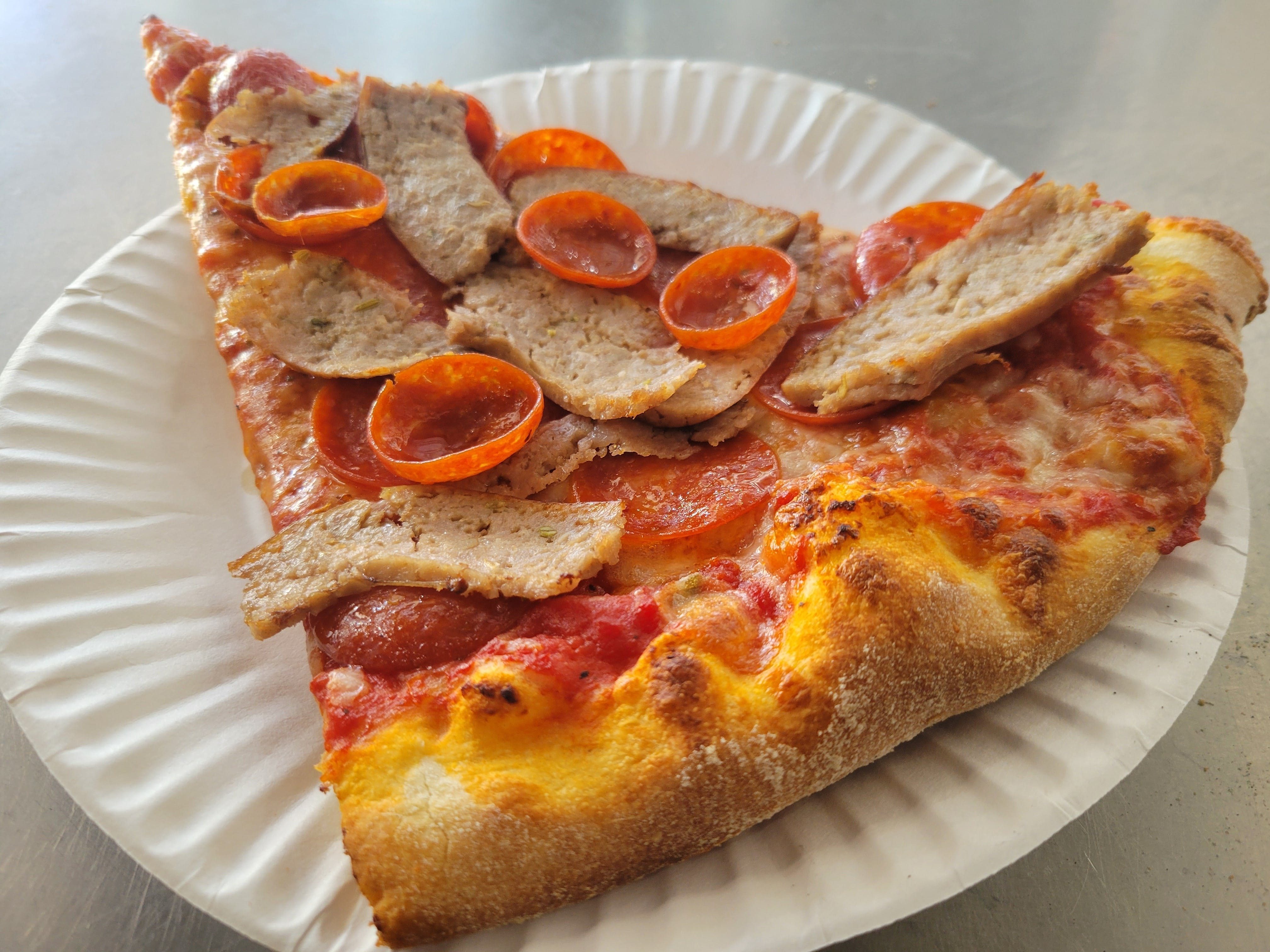 Pepperoni & Sausage Pizza Slice.