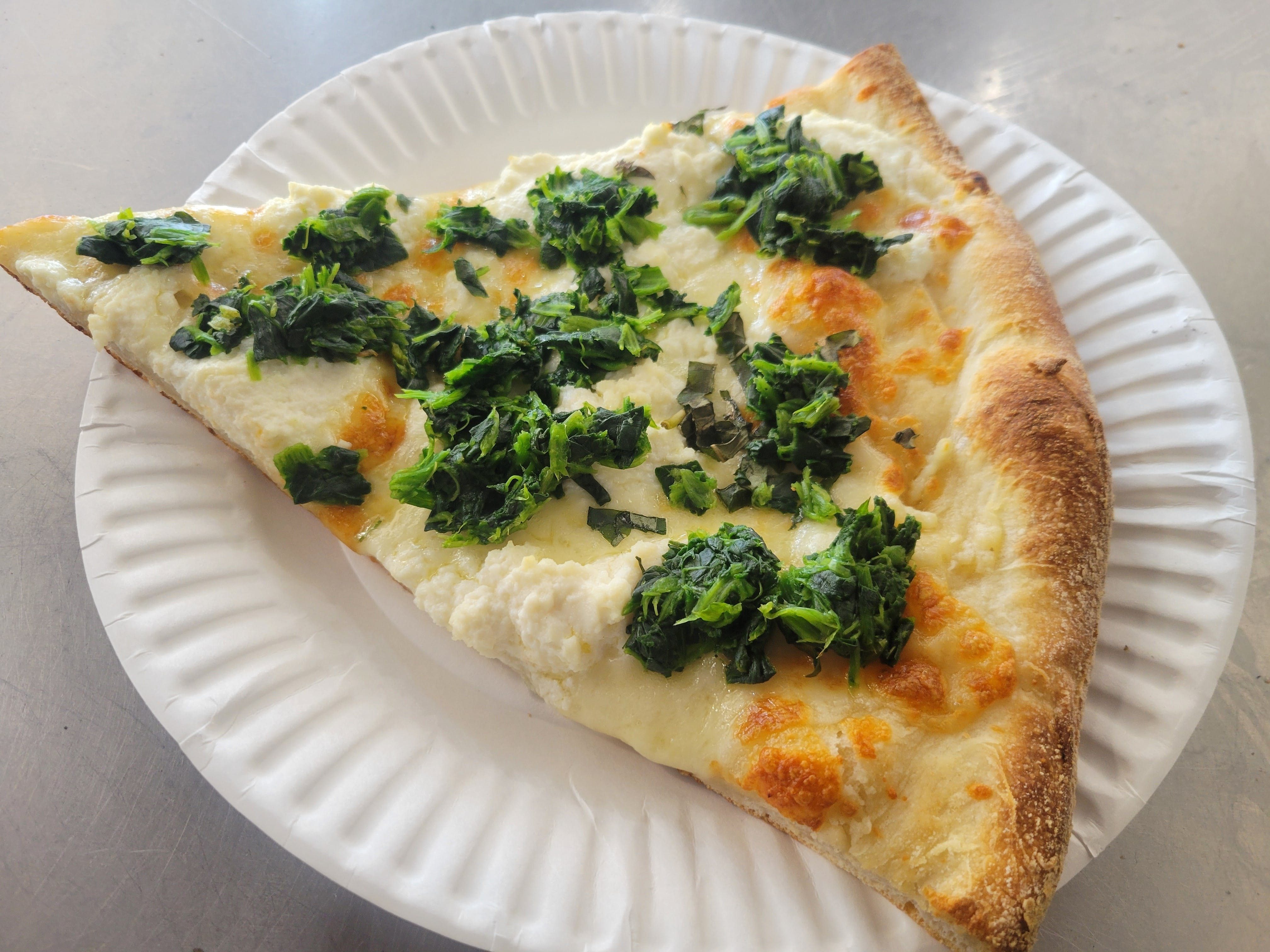 White Pizza Slice With Spinach.